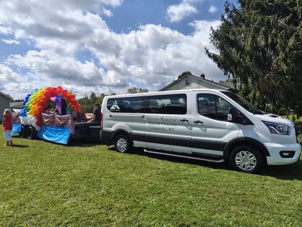 Church van and parade float serving the community